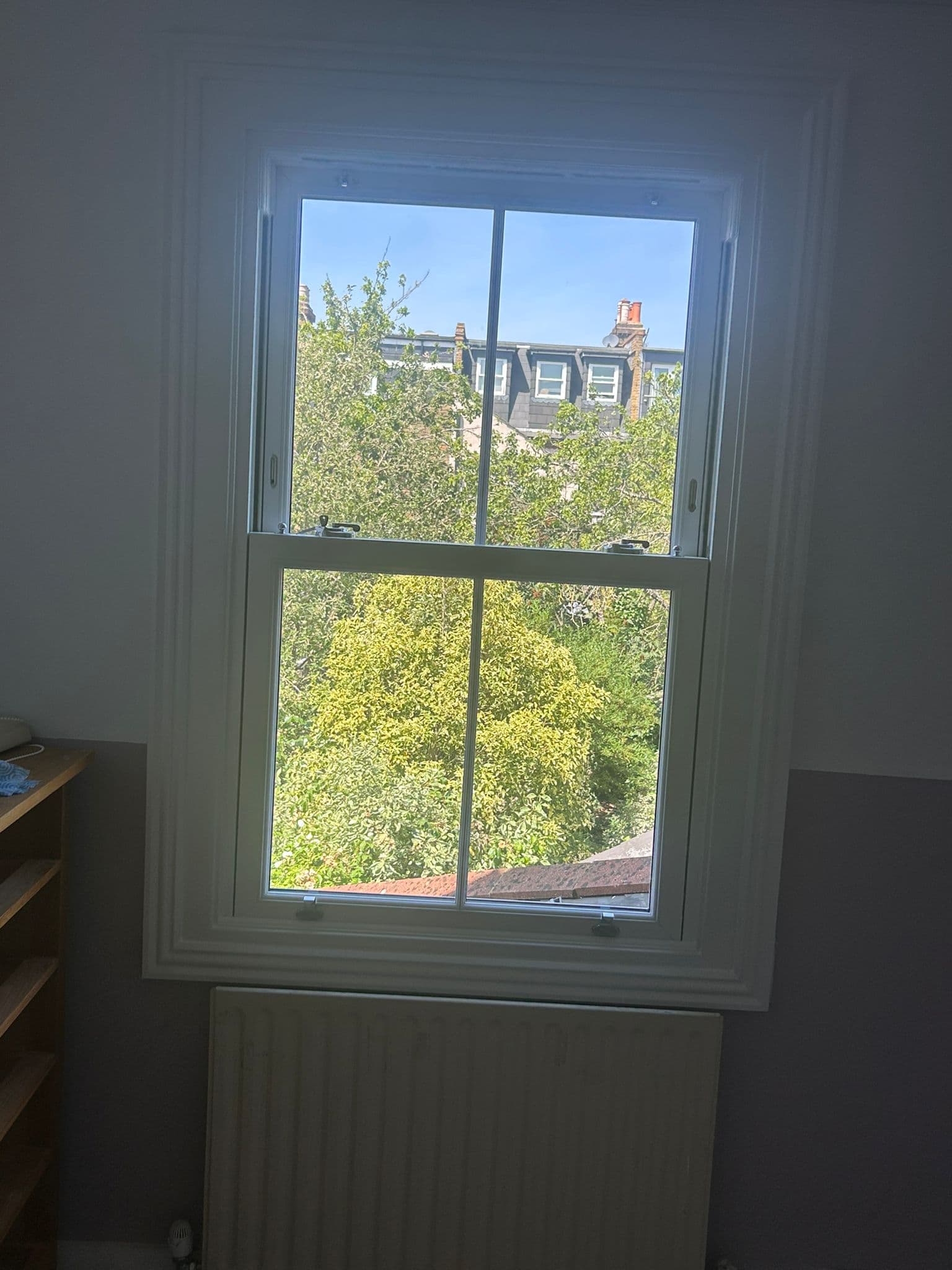 New sash window interior with garden view — London