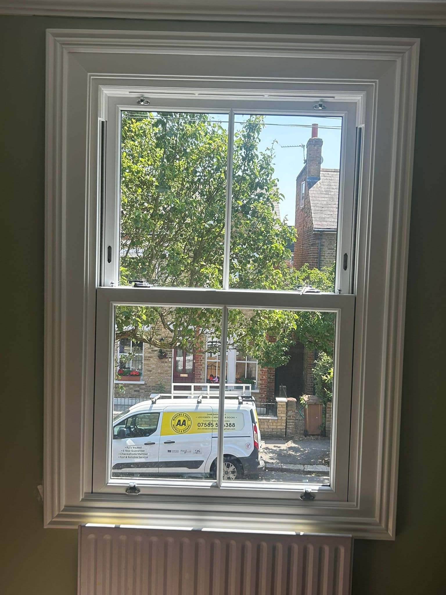 New sash window installation with AA Windows & Doors van visible outside — London Victorian terrace
