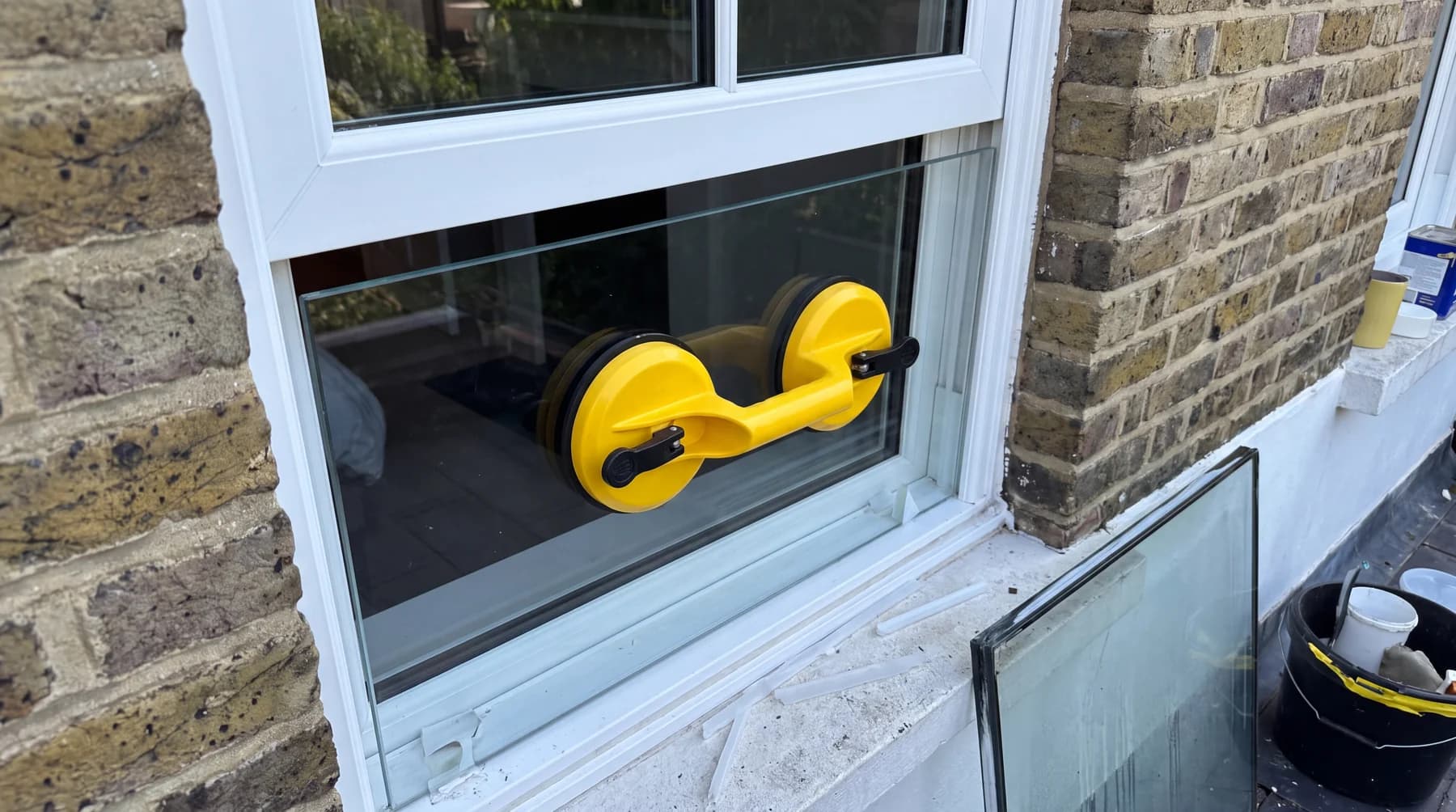 Misted double-glazed unit replacement with yellow suction lifters
